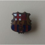 Una de las primeras insignias del Foot-ball Club Barcelona, producida en Suiza por Hugenin, empresa de la que fue representante Joan Gamper.